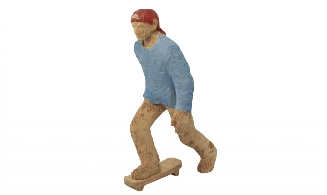 Wood sculpture skateboarder